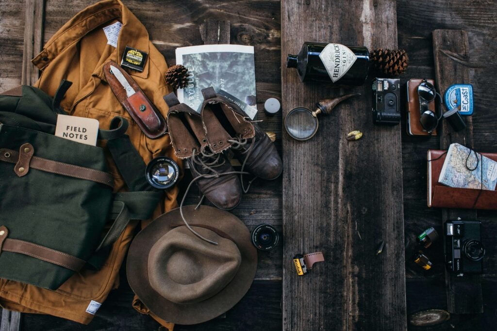 Basic hiking gear essentials laid out on the ground