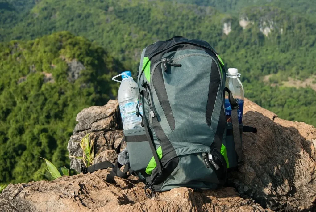 Day hiking backpack with hydration system on trail