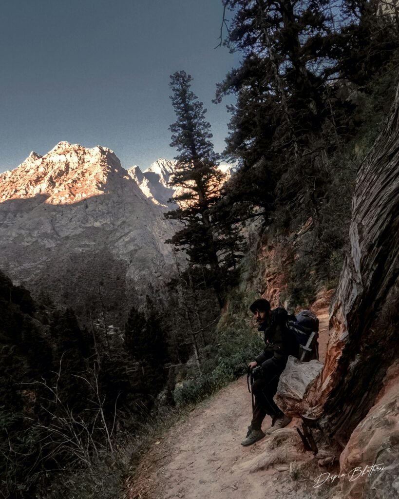 Thru-hiking hiker in the mountain path along a clif