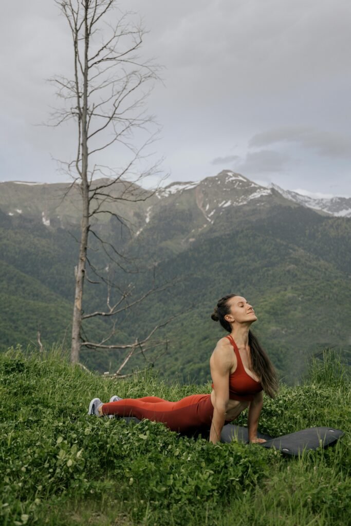 Streatching in front of mountains while hiking